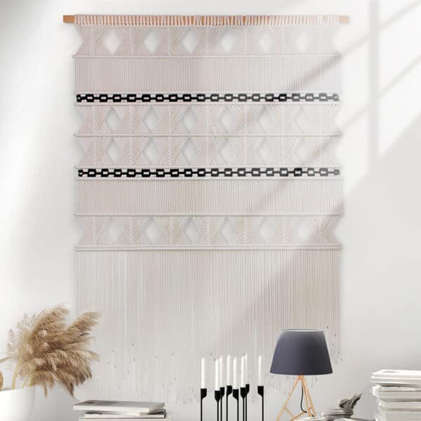 Modern Macrame Wall Hanging in Natural colour cotton placed on white wall in modern living room with white sofa