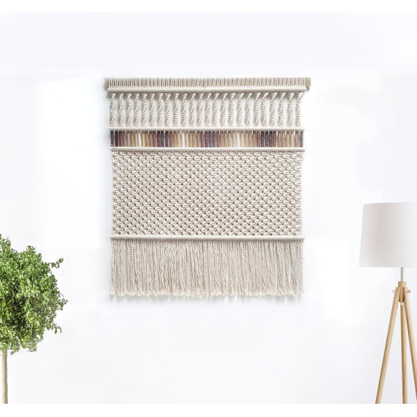 Close up of Large Sozarri Ombre macrame wall hanging in Boho style on white wall
